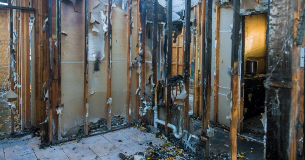 A destroyed interior of a person's home before insurance claims
