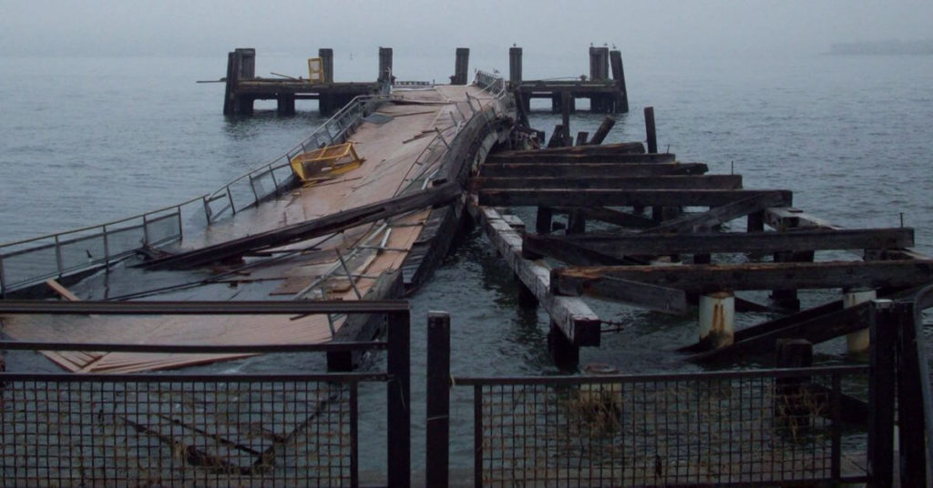 A destroyed dock on the shore after hurricane dorian