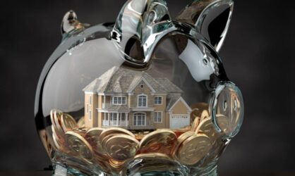 A glass piggy bank with a house and coins inside public adjuster