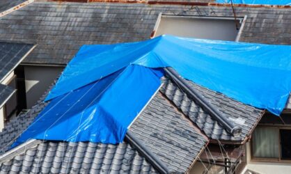A house with roof damage after insurance settlement has been approved